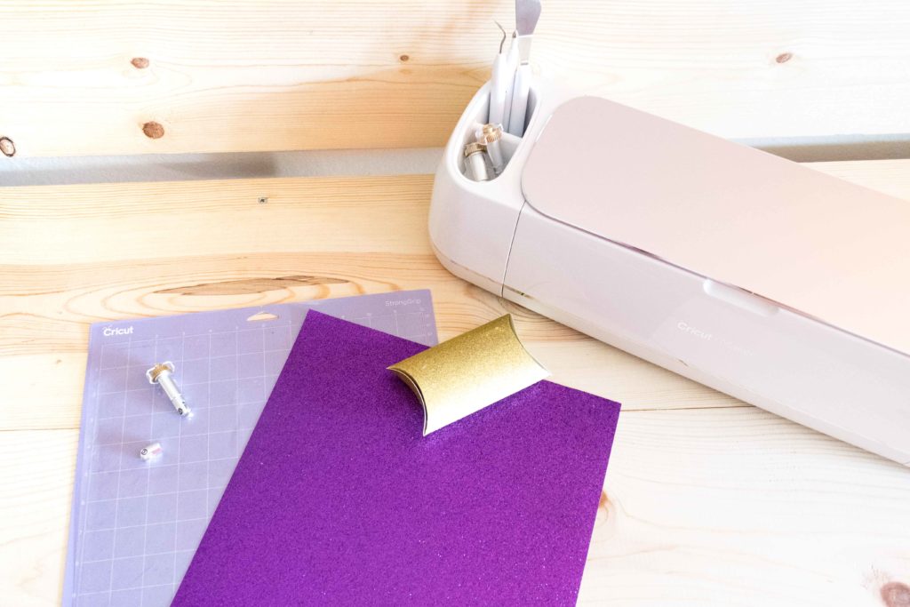 Cricut Maker and some materials to make a purple pillow box using the scoring wheel