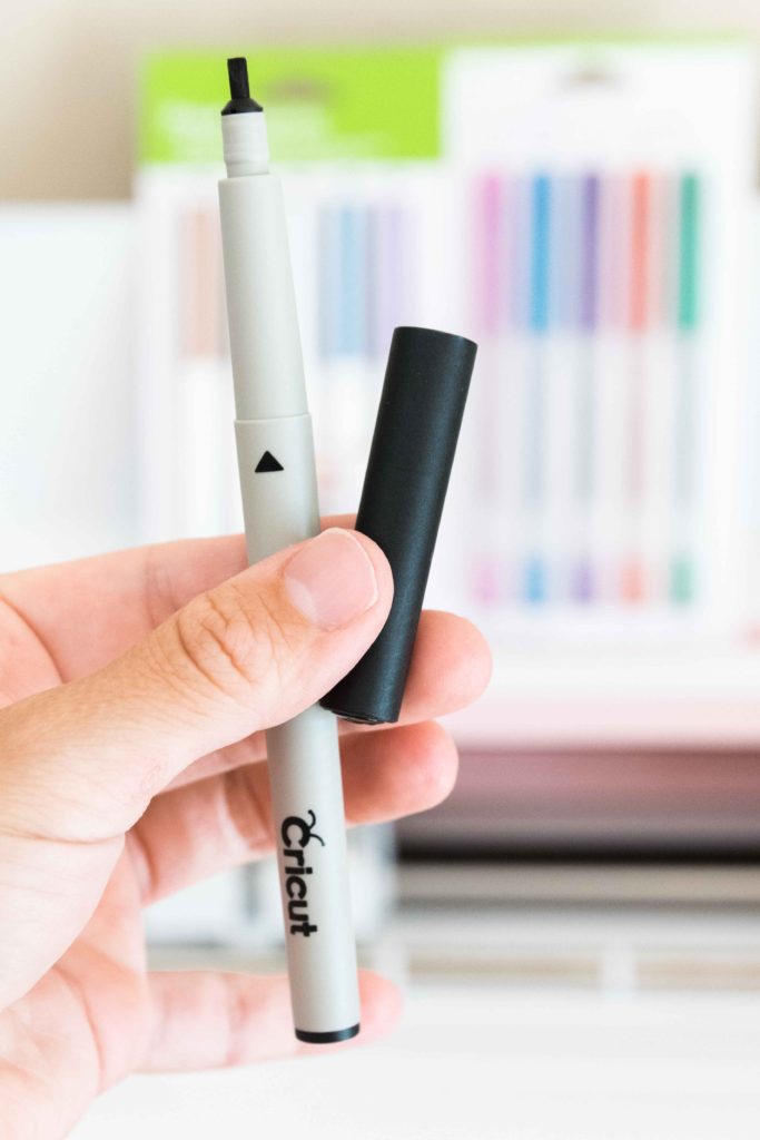 Holding Cricut Black Calligraphy Pen 