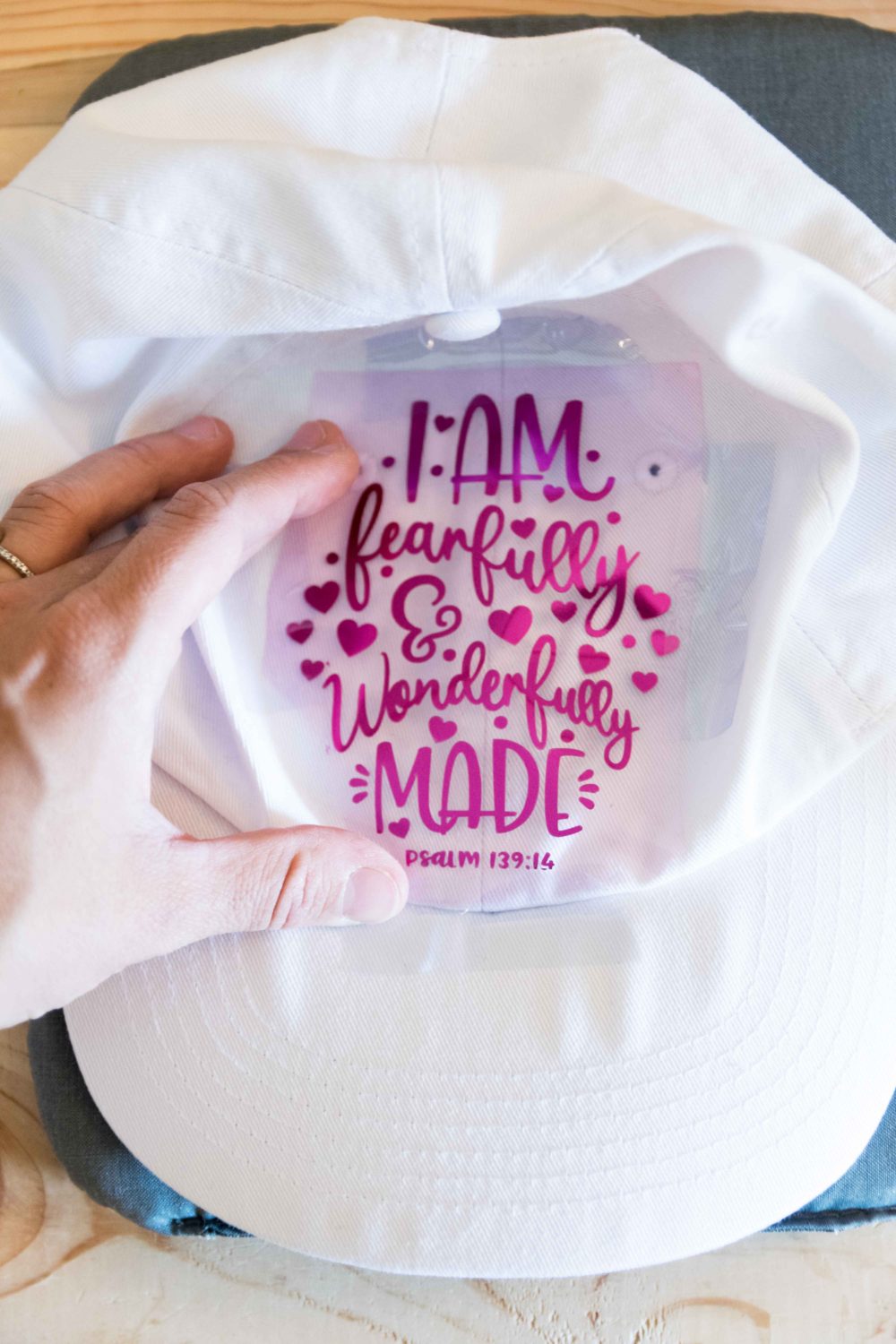 Taping design in a white hat with heat transfer tape