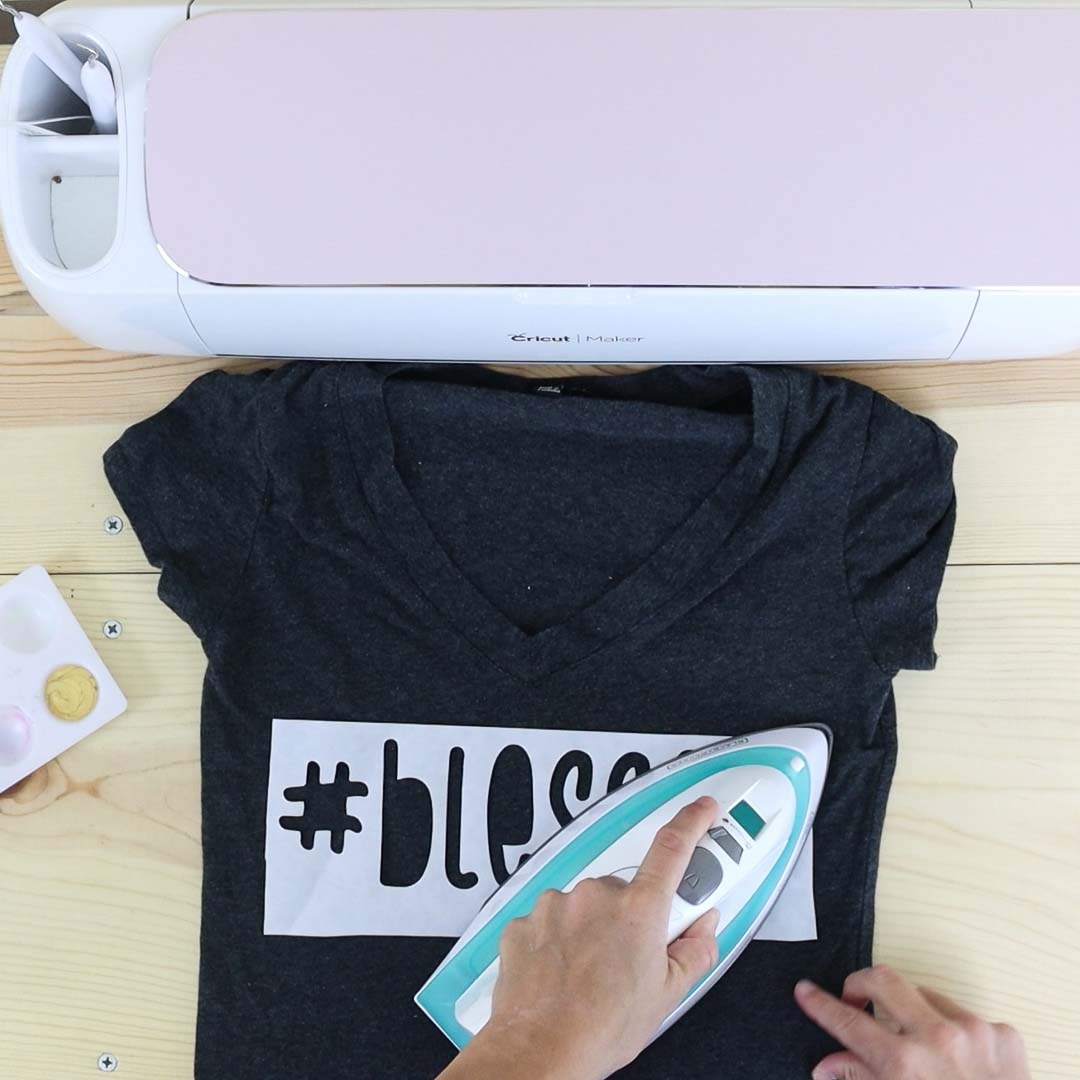 bonding freezer paper to a shirt with a regular household iron.