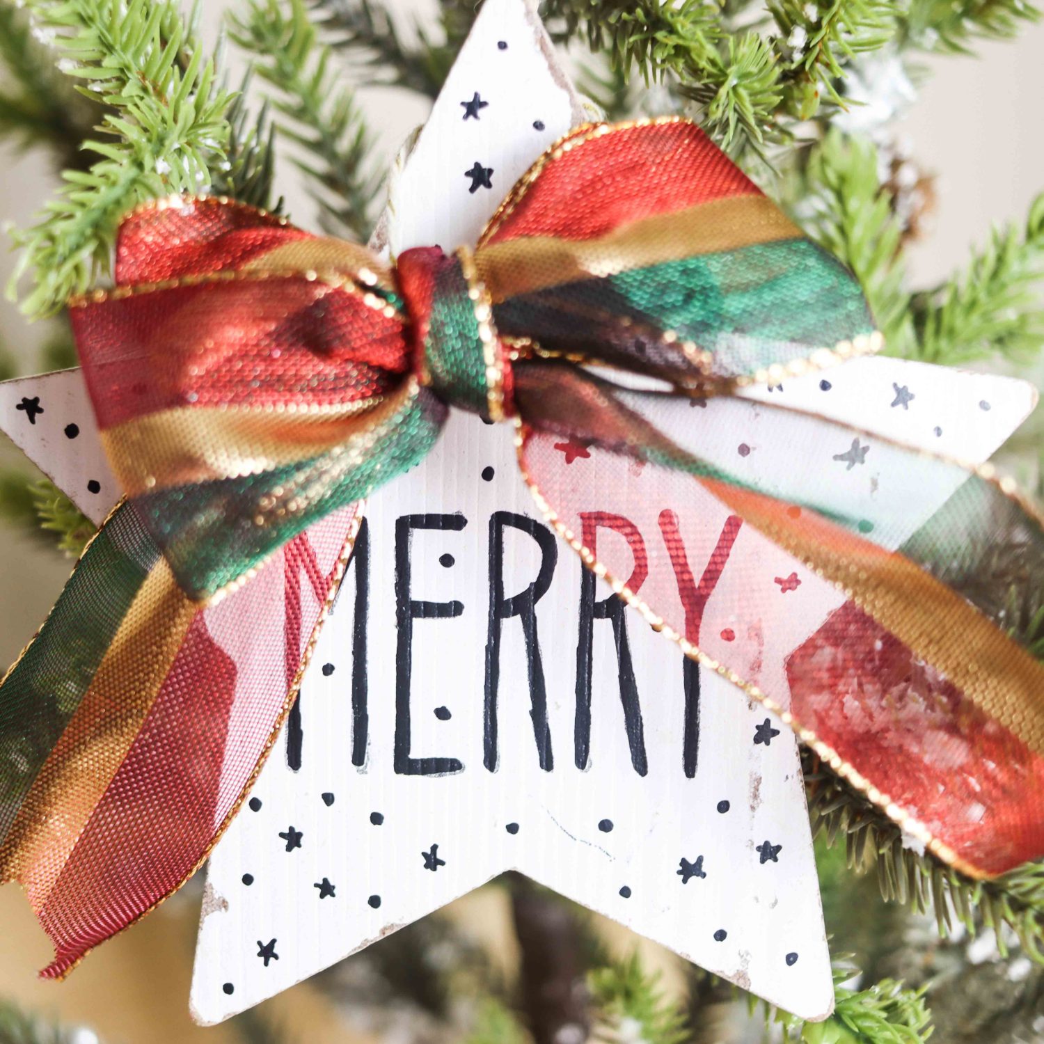 Star wooded Christmas Ornament on Christmas tree.