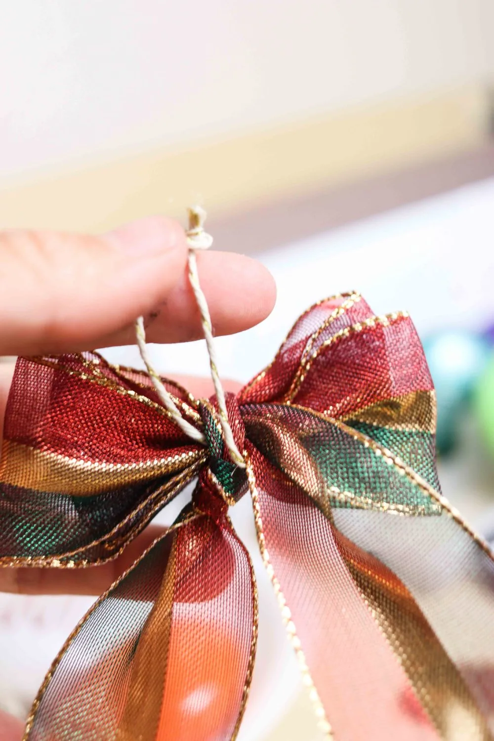 cord attach to decorative bow