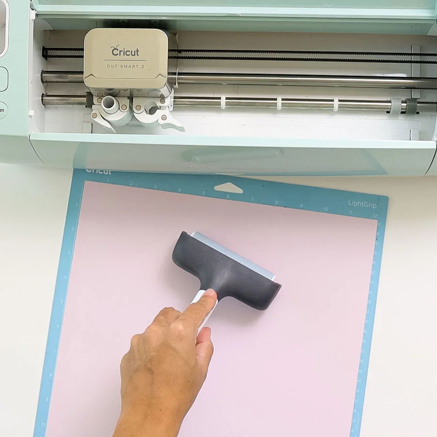 placing paper on cricut mat