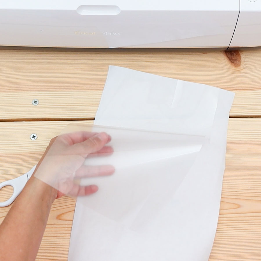 placing heat transfer mask on freezer paper