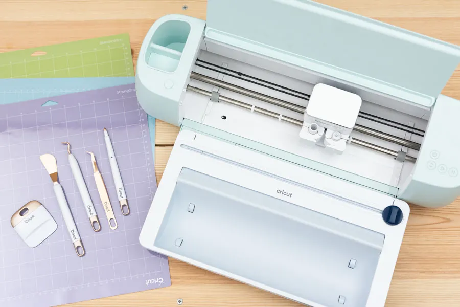 cricut explore 3 with vinyl roll holder, cricut mats and tools