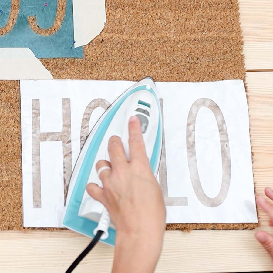 using an iron to transfer freezer paper to doormat