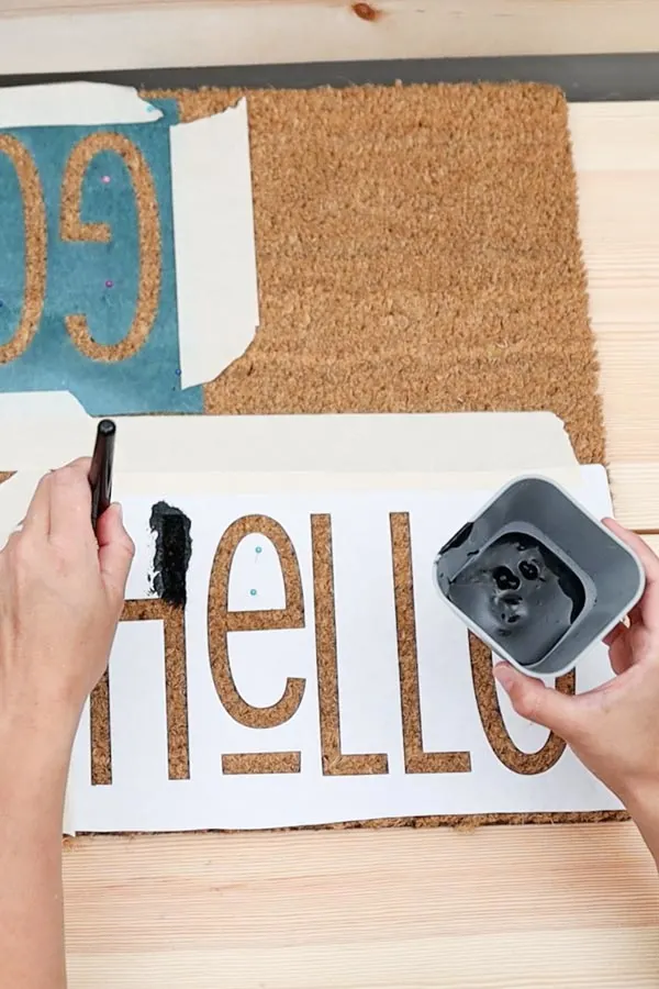 painting doormat on freezer paper stencil