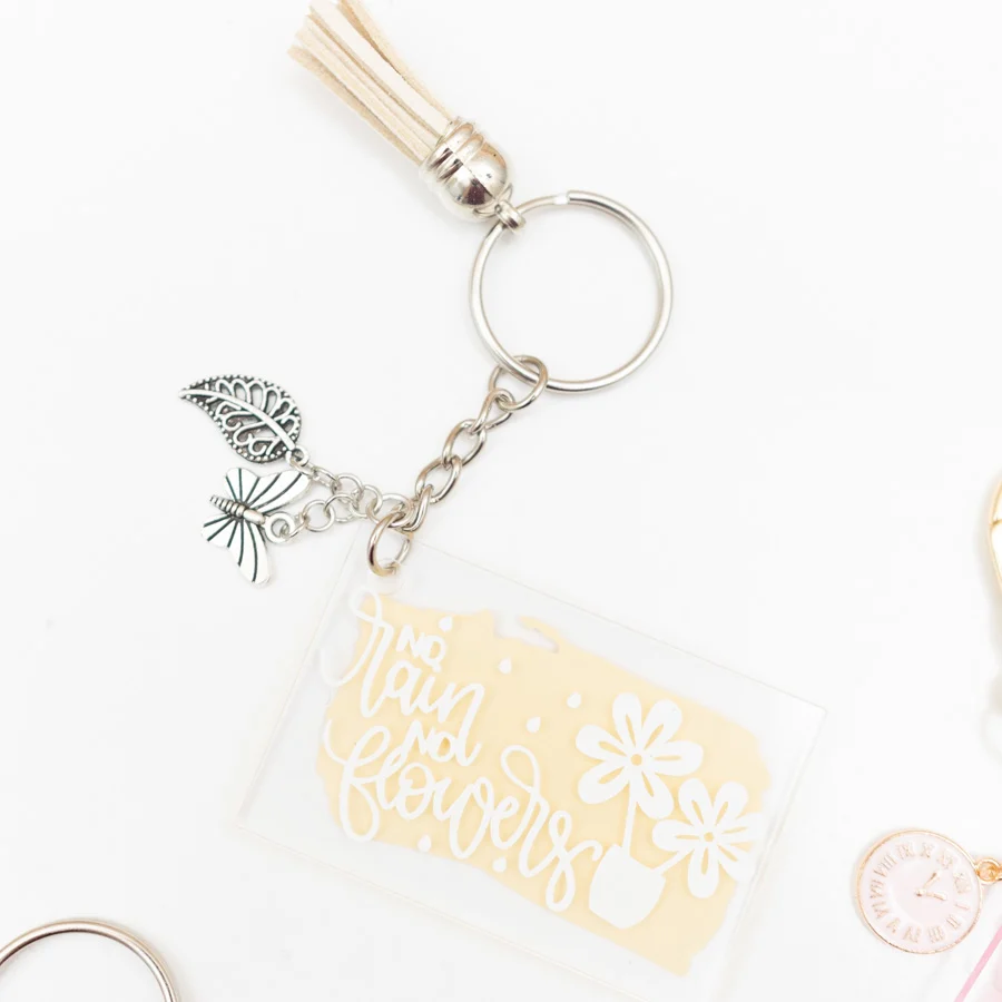 yellow and silver keychain no rain no flowers