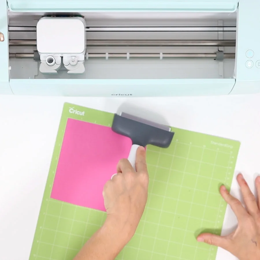 preparing cricut mat with pink cardstock