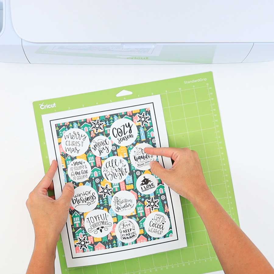 placing sticker sheet on cricut mat