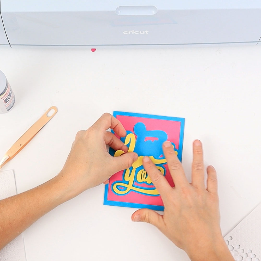 gluing text with foam dot to front of valentines day card