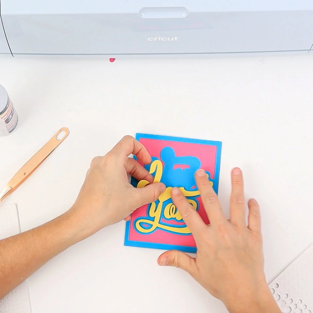 gluing text with foam dot to front of valentines day card