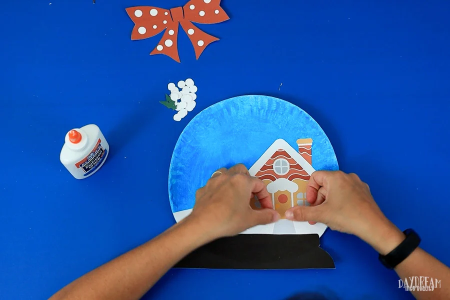 gluing path on snow globe paper plate craft