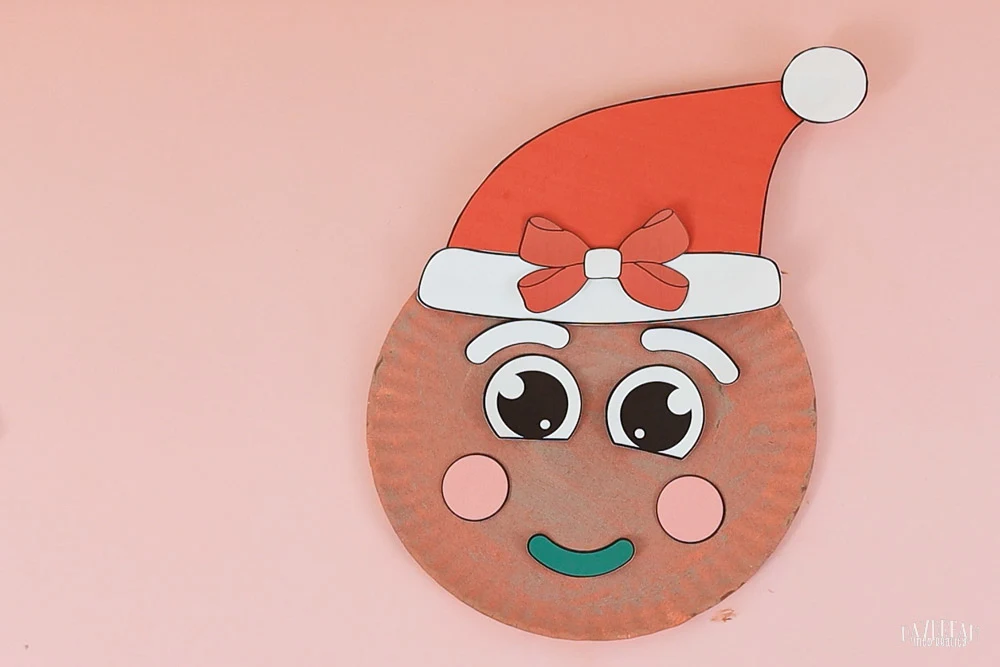 gingerbread girl with Santa hat - craft for kids with paper plates.