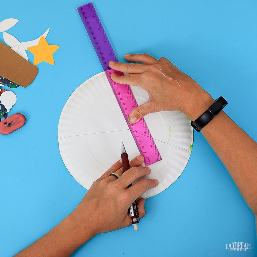 use a ruler to divide paper plate