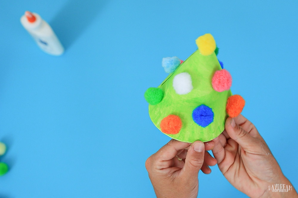 Christmas tree in cone shape with pom pomps