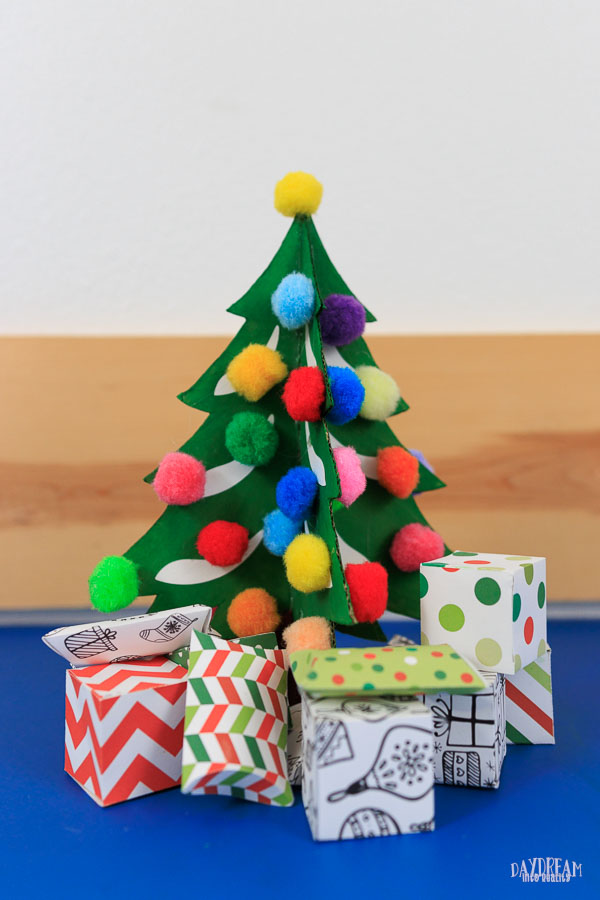 Cardboard Christmas Tree Craft Kids - With pom poms as ornaments and mini gift boxes.