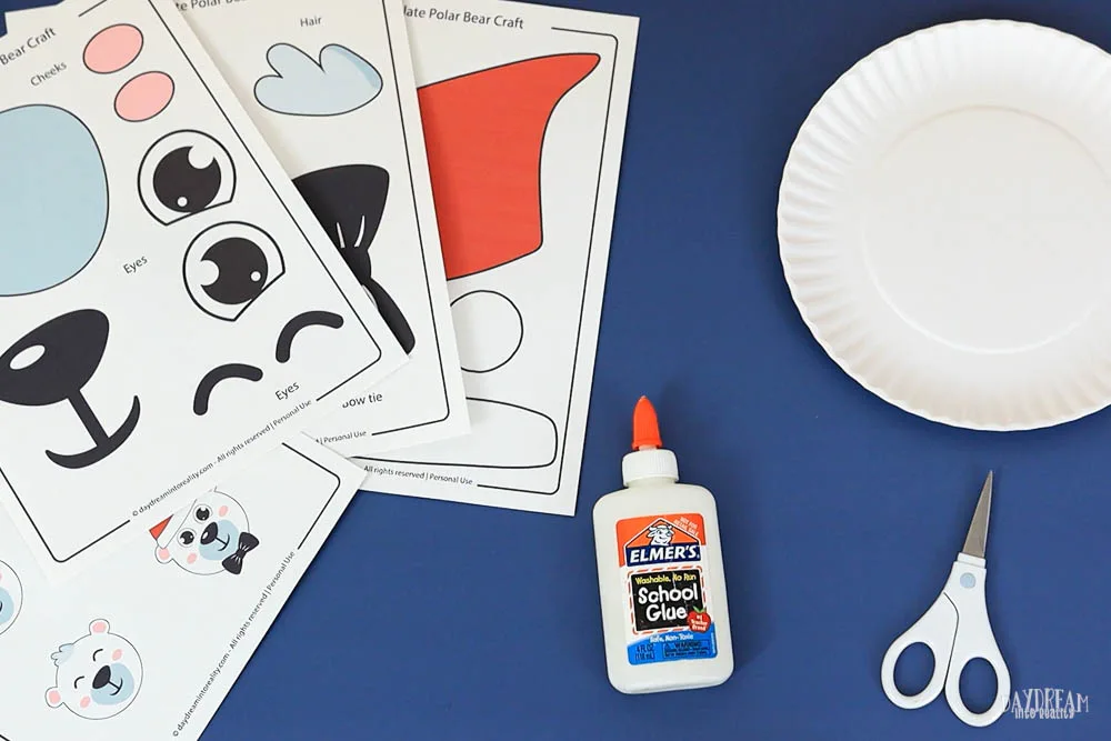 materials for making a polar bear craft for kids using paper plates