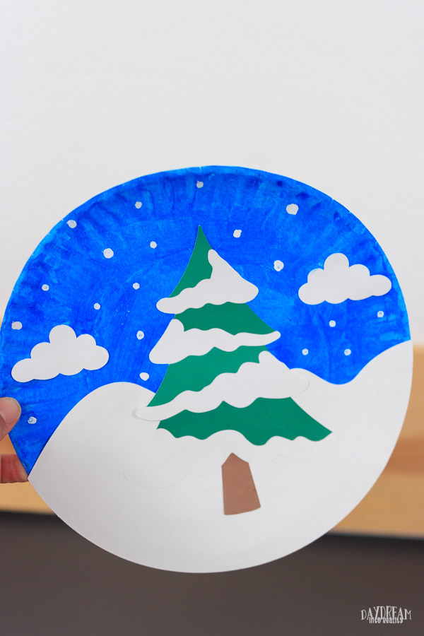 featured image paper plate winter tree scene. Evergreen nigh scene.