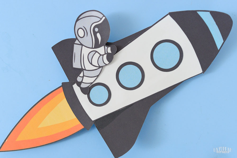 Fun paper rocket craft with a little astronaut riding it.