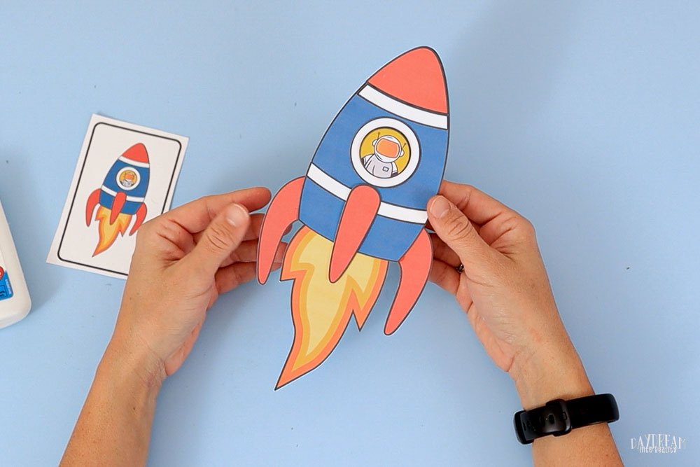 final paper rocket with little astronaut inside