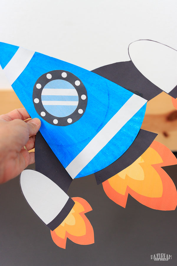 blue paper plate rocket craft for kids.