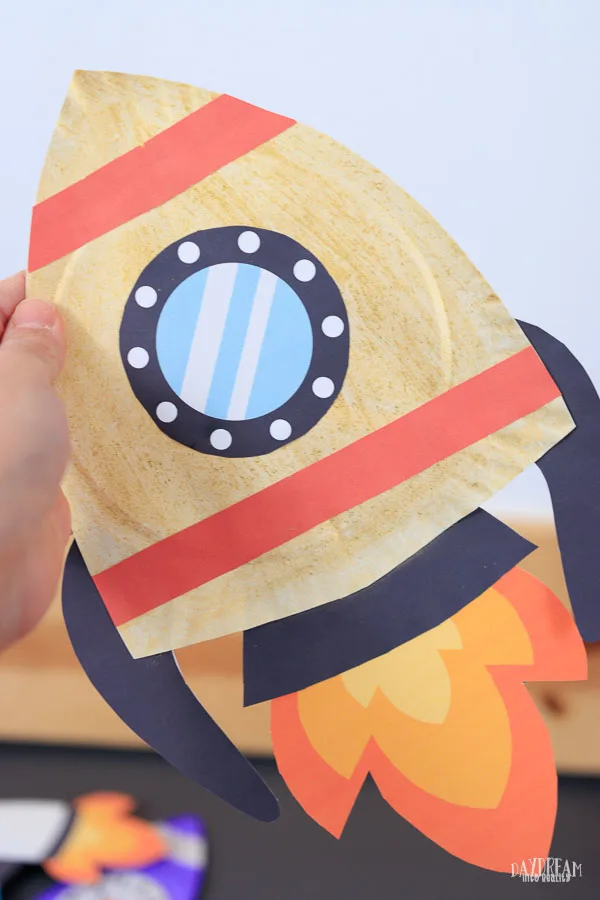 gold paper plate rocket craft for kids.