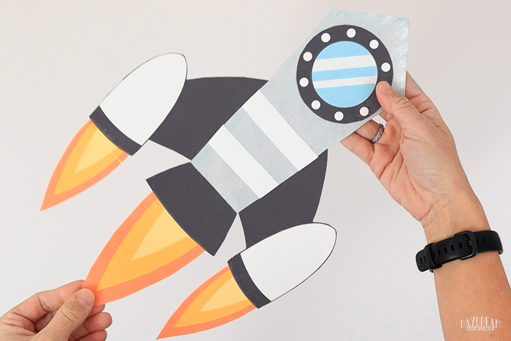 grey/silver paper plate rocket craft for kids.